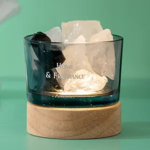 Home crystal stone aroma diffuser in blue glass jar with wooden base and essential oils