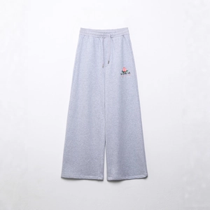 Pantalon de jogging gris clair à jambes larges avec cordon et broderie pêche
