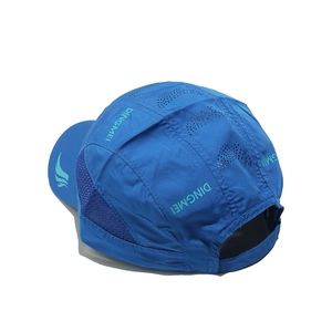 Close-up of royal blue sports cap featuring breathable side mesh and laser-cut vents