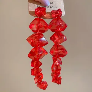 Red irregular acrylic ice cube drop earrings with translucent multi-faceted beads