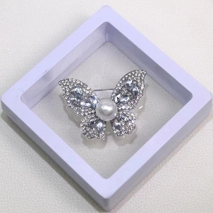 Elegant silver butterfly brooch with crystals and pearl in a white gift display box