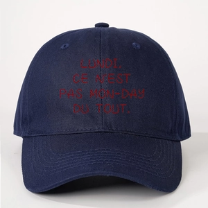 Dark blue cotton baseball cap featuring red Lundi Ce N'est Pas Mon-Day printed slogan