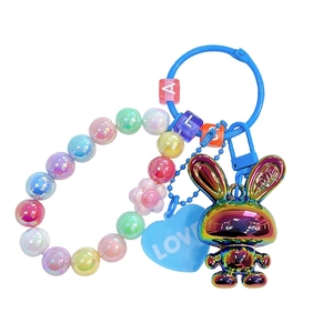 Cartoon iridescent rabbit keychain with colorful beads and a blue heart love charm