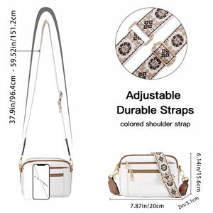 White PU leather crossbody bag with brown trim and colorful floral embroidered strap