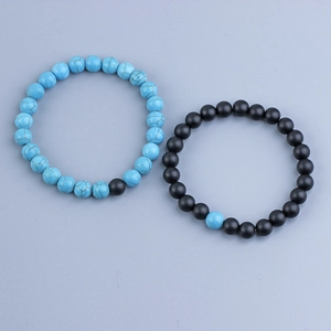 Detailed view of 8mm lava rock and turquoise bead bracelets with elastic cord