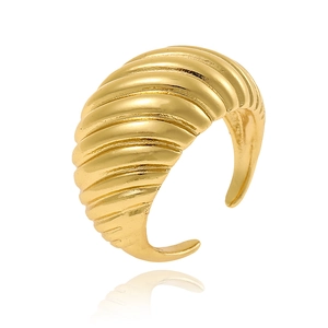 Macro view of gold croissant ring featuring textured twisted details and polished finish