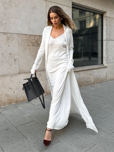 Women's two-piece cream knit set featuring a long cardigan and slim maxi dress