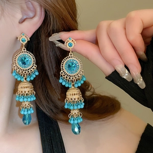 Bohemian gold tassel drop earrings with blue crystals and vintage ethnic hollow design