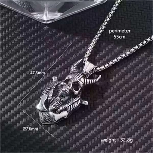 Hip hop silver horned skull pendant necklace on carbon fiber background with size markers