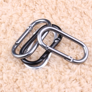Three durable aluminum D-ring carabiners in black, silver, and grey on a soft background