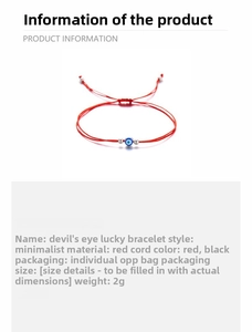 Detail of handmade evil eye charm bracelet with red woven rope and silver beads