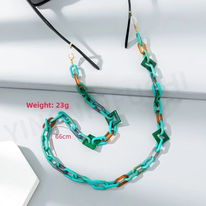 Detail view of colorful acrylic glasses chain with golden clips and silicone loops