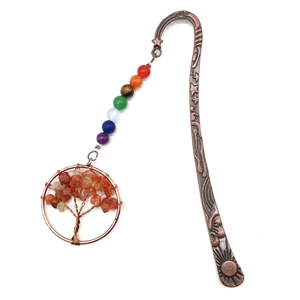 Close-up of bronze bookmark featuring tree of life pendant and seven chakra stone beads