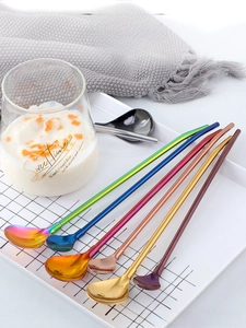 Polished 304 stainless steel straw spoons in six metallic colors on a tray