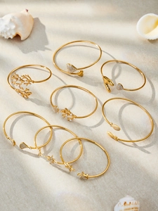 Détails des bracelets marins plaqués or 18 carats avec motifs d'étoile de mer et perles