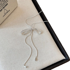 Elegant silver bow pendant necklace with tassel snake chains and metal teardrop charms