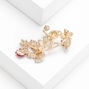 Back view of squirrel brooch with golden alloy plating and secure pin fastener