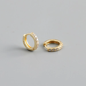Close-up of gold plated S925 silver hoop earrings with white zircon stone inlay