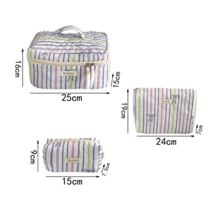 Three-piece purple striped makeup bag set with bow detail and specific size dimensions