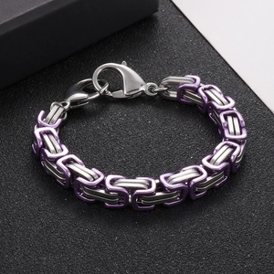 Detail of silver and purple interlocking Byzantine chain bracelet with lobster clasp