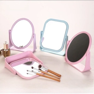 Close-up of pastel desktop makeup mirrors with multi-angle rotation and matte finish