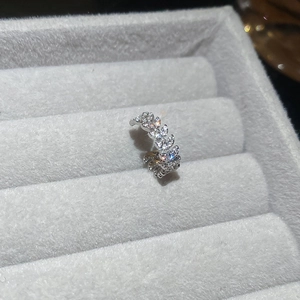 Macro detail of silver leaf ear cuff with sparkling marquise-cut marquise zircon stones