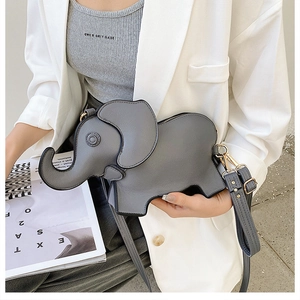 Detail of grey elephant shaped crossbody bag showing leather texture and adjustable strap