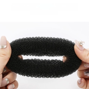 Elastic black mesh donut hair bun maker showing high stretchability and durable material