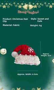 Detail of red Christmas hat hair clip with white pearls and a silver snowflake charm