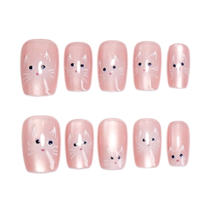 Short pink cat eye press-on nails with cute white cat face patterns in a 10-piece set