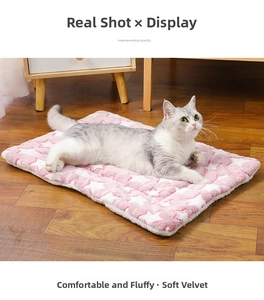Cat resting on a thick pink plush pet mat with white stars and soft fleece texture