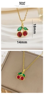 Macro view of cherry pendant necklace with red zircon and size 18x14mm measurement detail