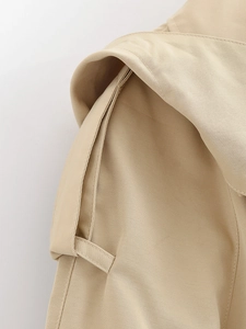 Macro detail of beige twill fabric stitching on hooded jacket shoulder and cuff