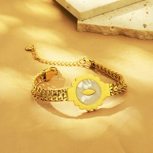 Elegant 18K gold-plated titanium bracelet with a round white shell pendant and gold leaf