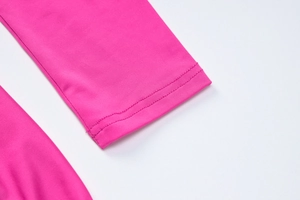 Detail shot of rose red dress cuff showing high-quality double stitching on elastic fabric