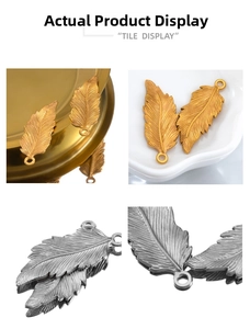 Detailed macro view of vintage stainless steel feather pendants in gold and silver finishes