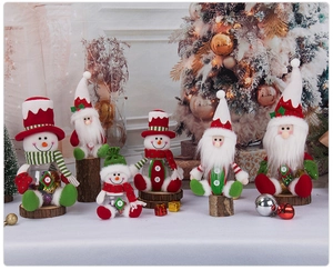 Detail of Christmas candy jar with plush Santa and Snowman figures for holiday gifts