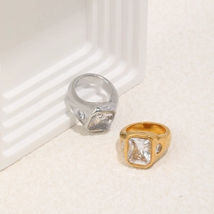 Macro view of gold and silver 18K plated rings with large rectangular cubic zirconia stones