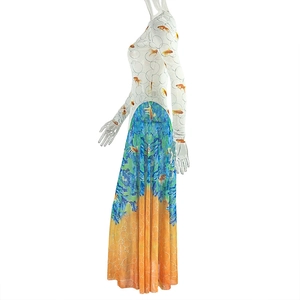 Detail of A-line long sleeve dress with goldfish print and blue-orange gradient hem
