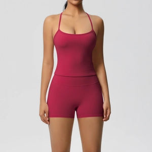 Close-up of wine red yoga set featuring high-waist shorts and a thin strap sports tank top