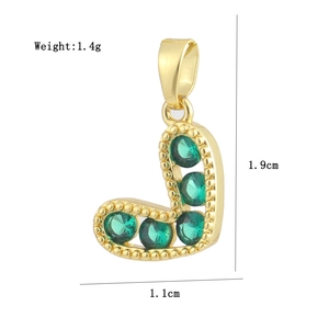 Detailed view of a gold letter J pendant with green zircons and size specifications