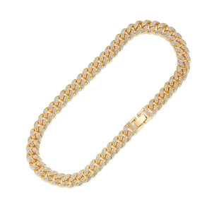 Gold-plated Cuban link chain for men with white cubic zirconia stones on white background