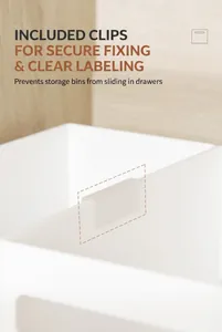 Close-up of white matte drawer organizer with U-shaped clip for secure labeling and stability