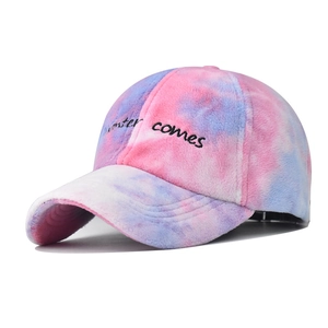 Winter tie-dye plush baseball cap in pink and blue with winter comes embroidery