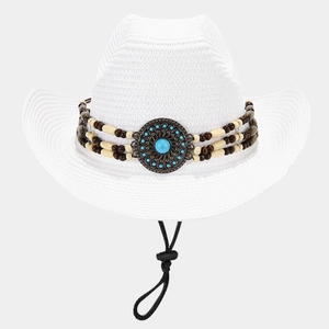 Close-up of white woven straw hat with turquoise beads and adjustable chin strap