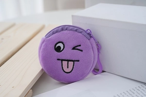 Detail view of mini plush purple coin purse with a winking face embroidery and plastic hook