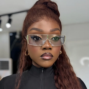 Fashion futuristic semi-rimless gold metal sunglasses with clear lenses on model