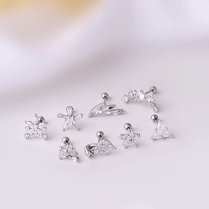 Set of 8 silver titanium steel earrings with sparkling cubic zirconia in flower and star shapes