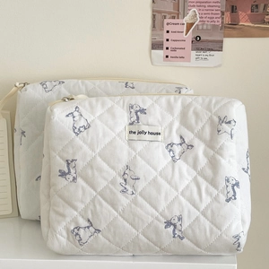 Quilted white cotton makeup bag with cute blue rabbit prints and a secure metal zipper