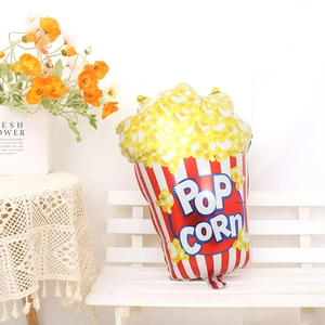 Red and white striped popcorn foil balloon with yellow kernels for party decorations